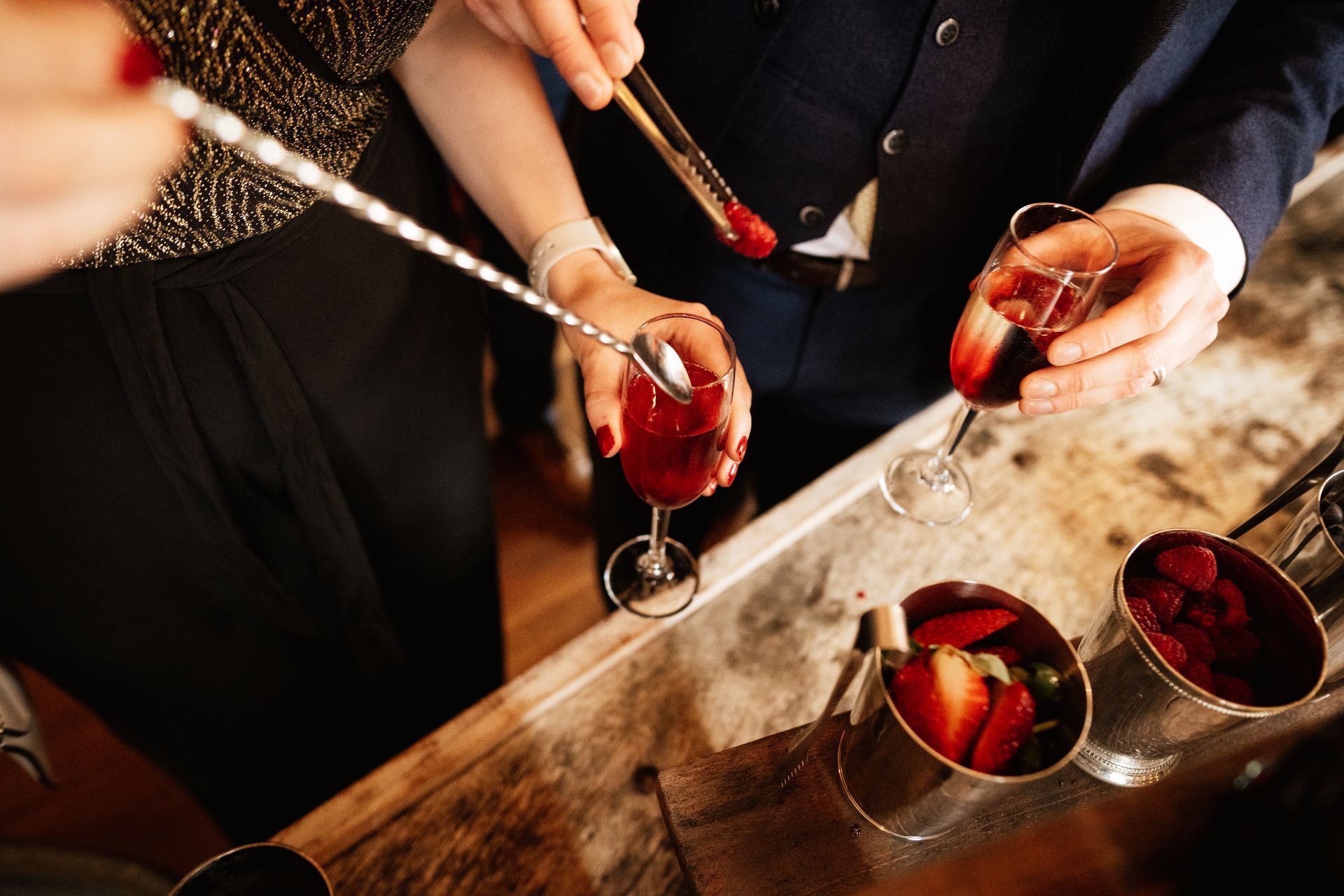 Adding the fruit to the prosecco at a wedding at Sopley Mill with Tasha Mae Wedding Co-ordinator.