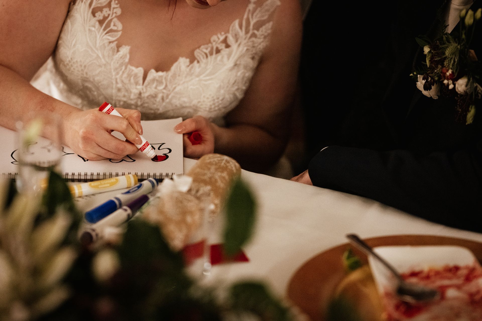 Bride colouring in a mind reading trick at a wedding at Sopley Mill with Tasha Mae Wedding Co-ordinator.