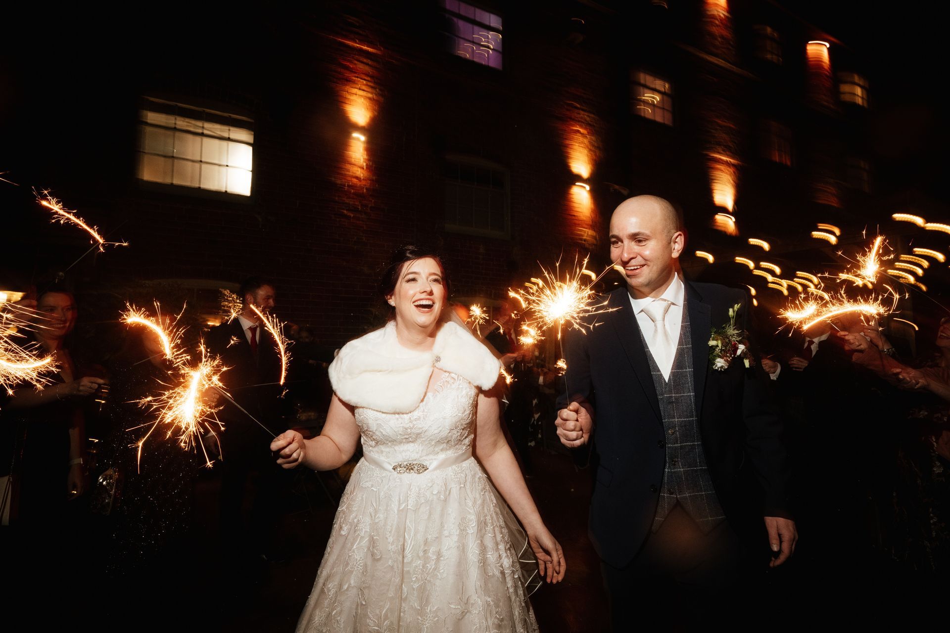 Bride and groom and their guests with sparklers at a wedding at Sopley Mill with Tasha Mae Wedding Co-ordinator.