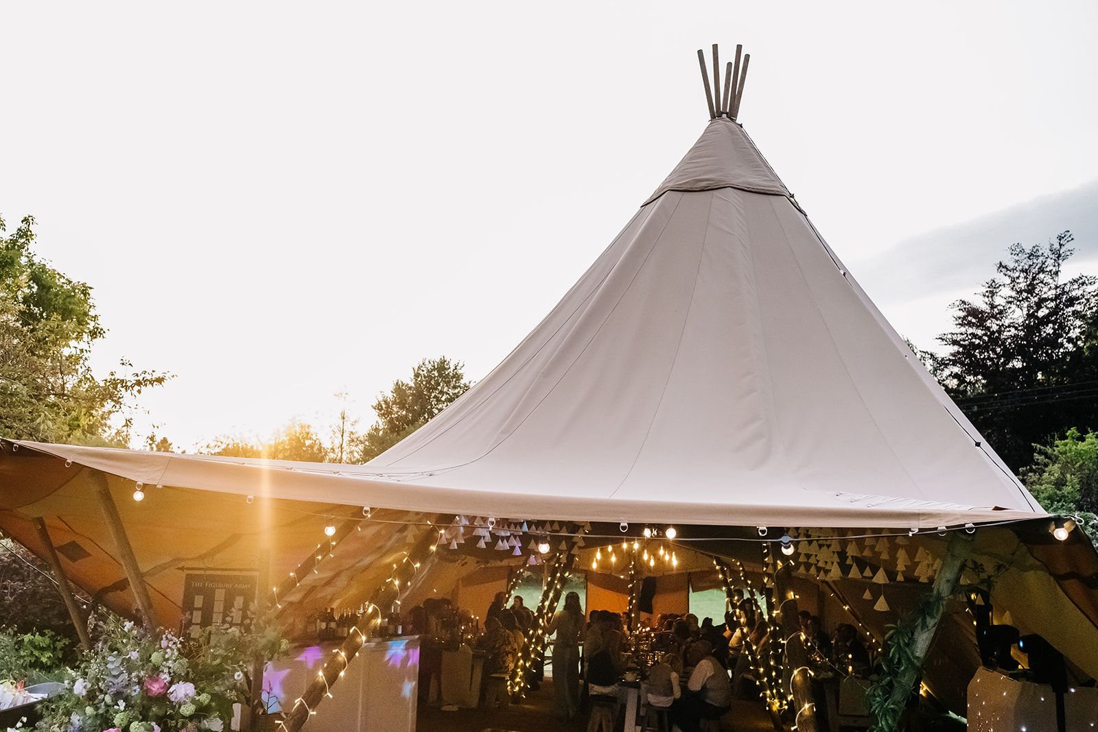 A tipi set up ready for a wedding in a garden co-ordinated by Tasha Mae Wedding Co-ordinator.