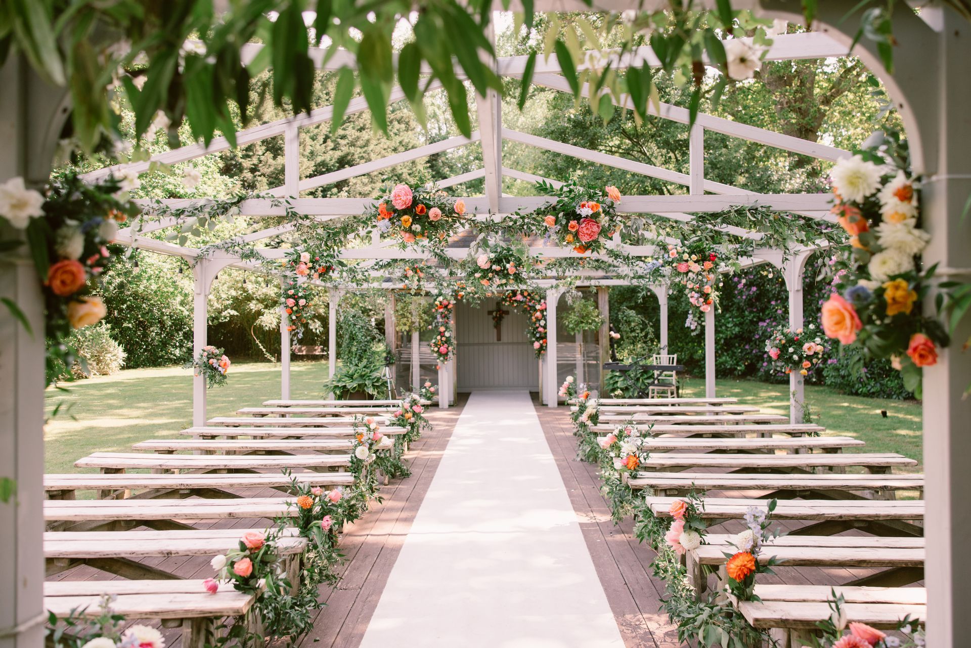 Wedding ceremony aisle at The Old Vicarage in Highcliffe, Dorset - co-ordinated by Tasha Mae Wedding Co-ordinator.