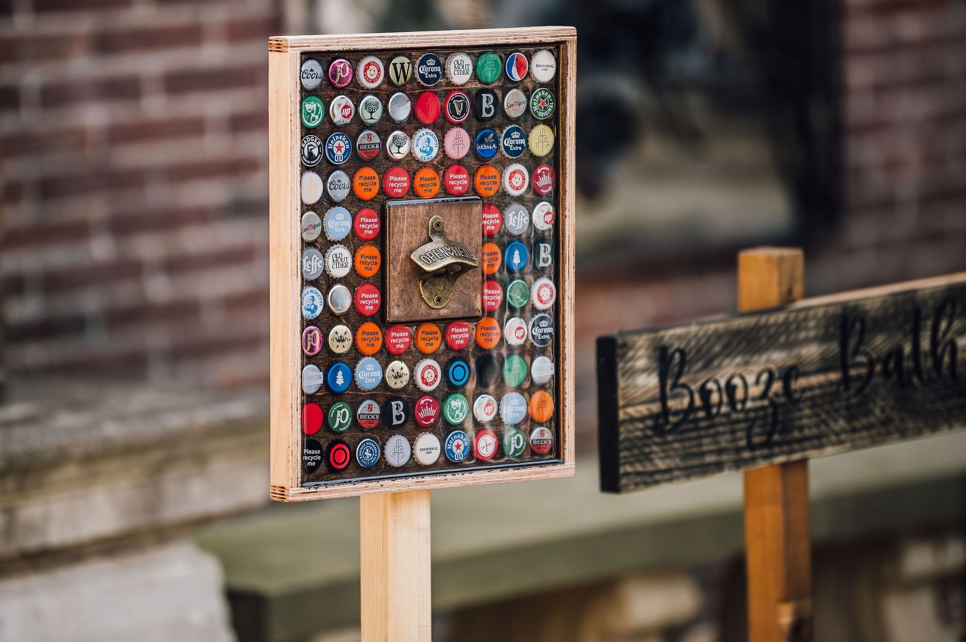 Freestanding bottle top opener made out of recycled bottle tops for hire from Mae & Maple Prop Hire.