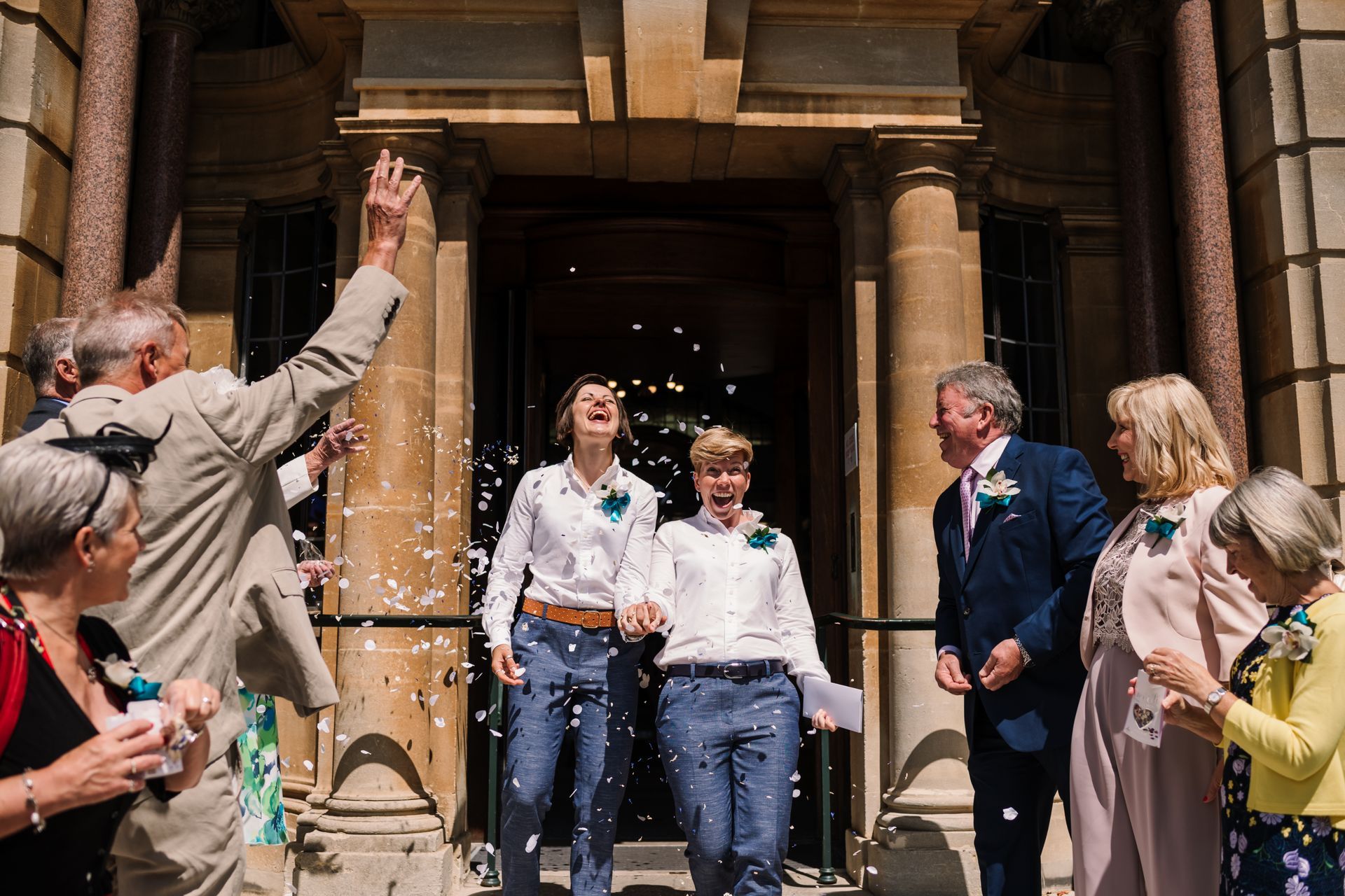 Bride and Bride walking down the steps at Bournemouth Registry Office after getting married co-ordinated by Tasha Mae Wedding Co-ordinator.