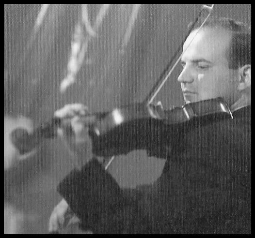 Constantinides playing violin in Greece