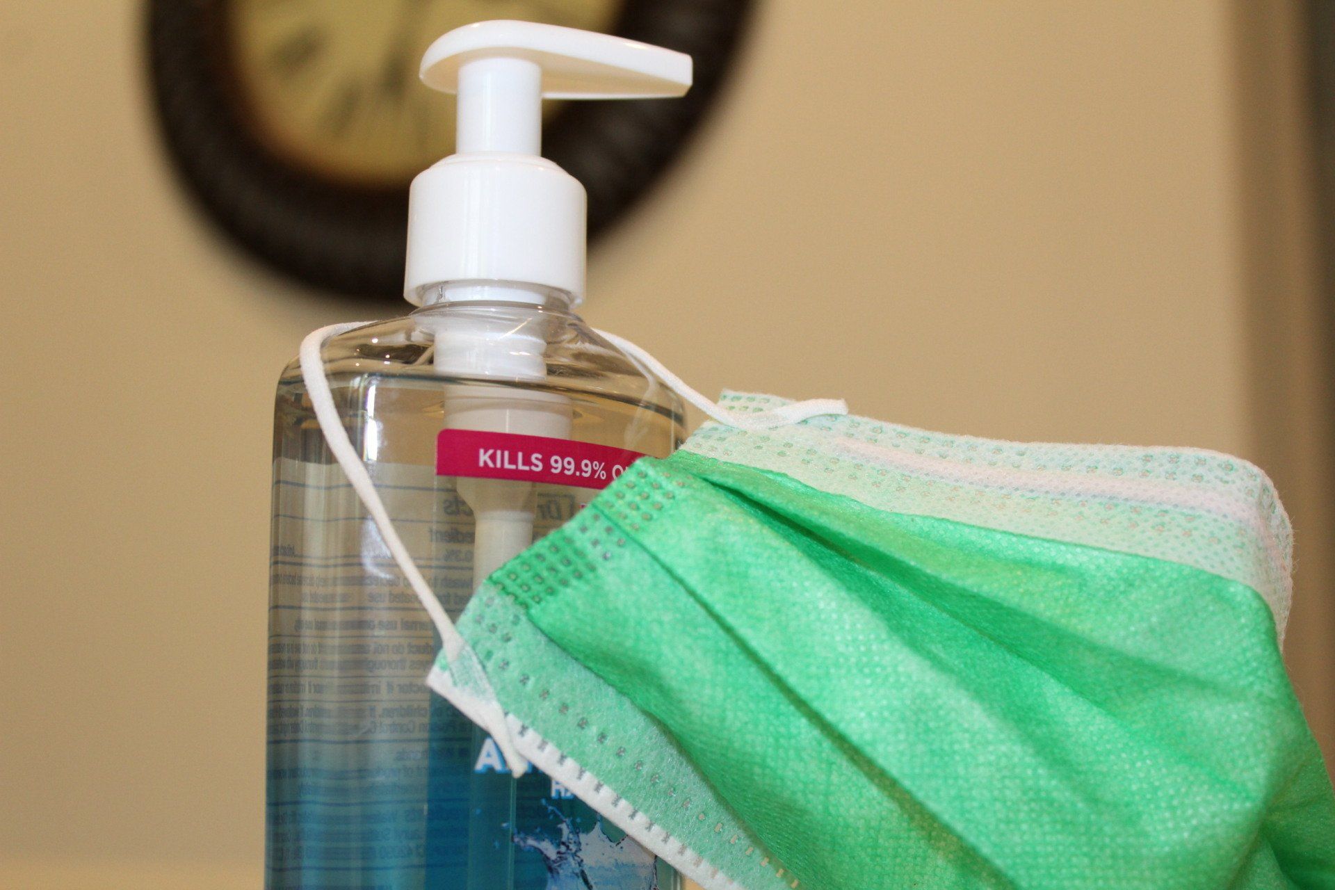 Hand sanitizer and surgical mask close-up