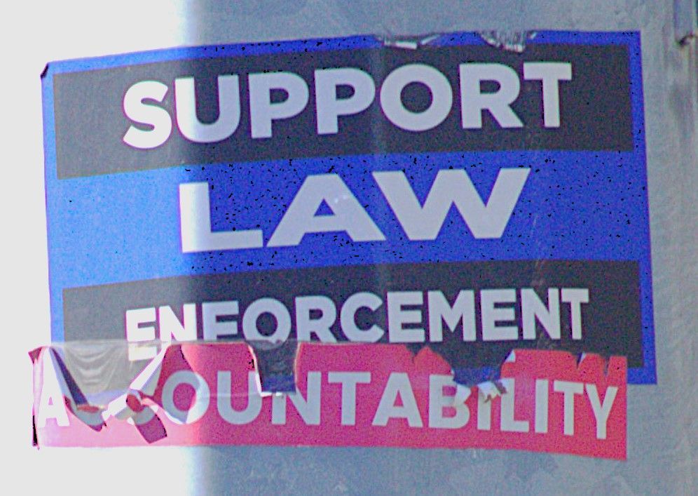 A black and blue sign saying