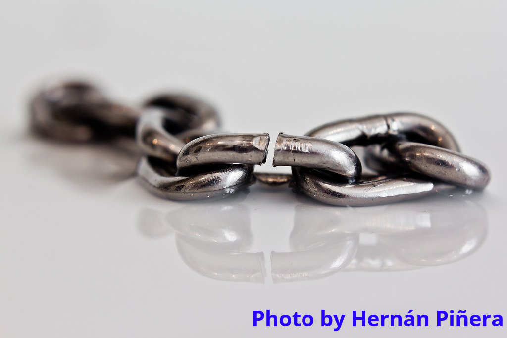 A steel chain with a stressed link