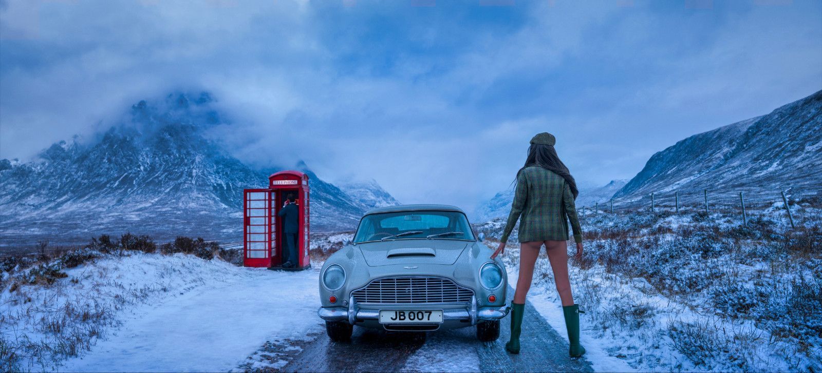 Colour photo by David Yarrow of female model next to Aston Martin and red phone booth in Glencoe, Scotland