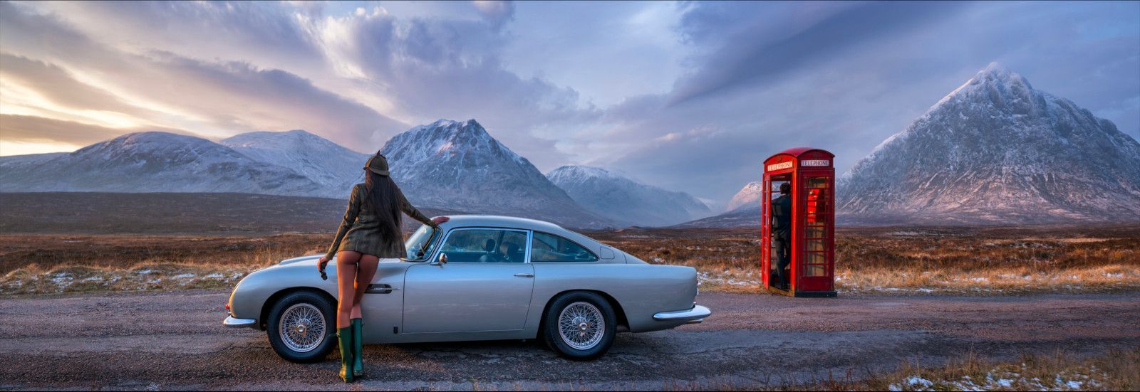 Skyfall colour edition photo of Model with Aston Martin and Phone Box in Glencoe, Scotland, by David Yarrow