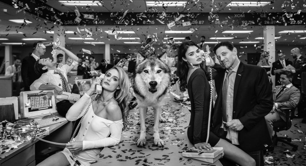 photograph of jordan belfort with wolf and money by david yarrow