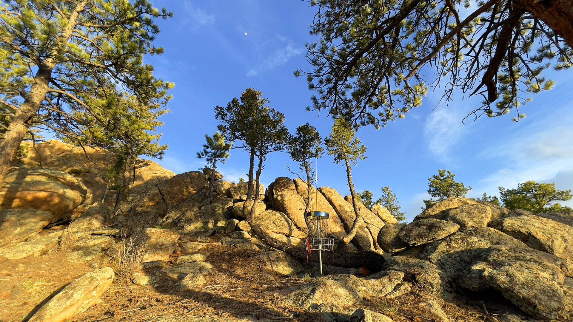 New disc golf hole 13 basket with moon at Sundance Trail Guest Ranch May 2022 New disc golf hole 13 basket with moon at Sundance Trail Guest Ranch May 2022