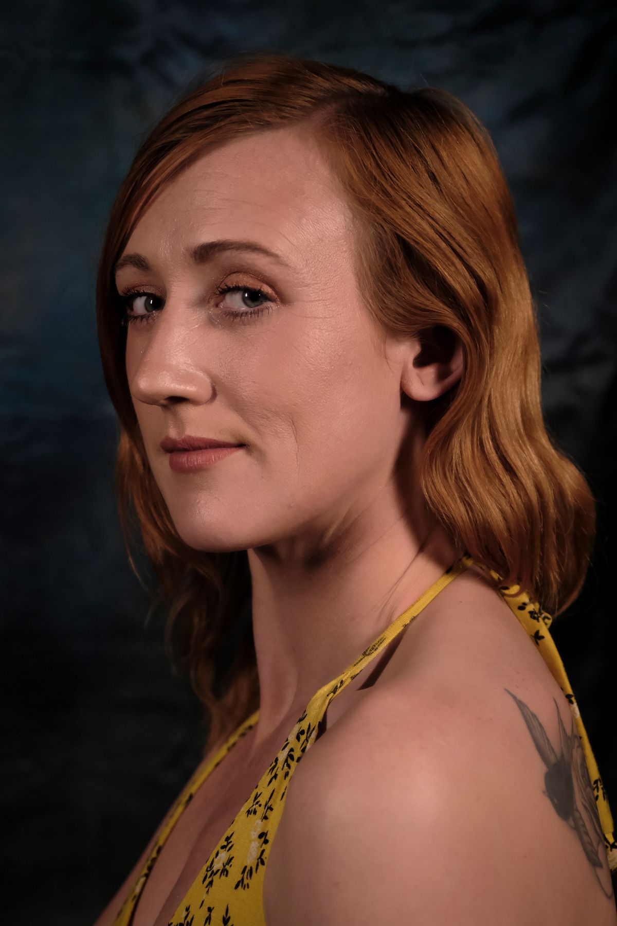 A profile portrait of a female model