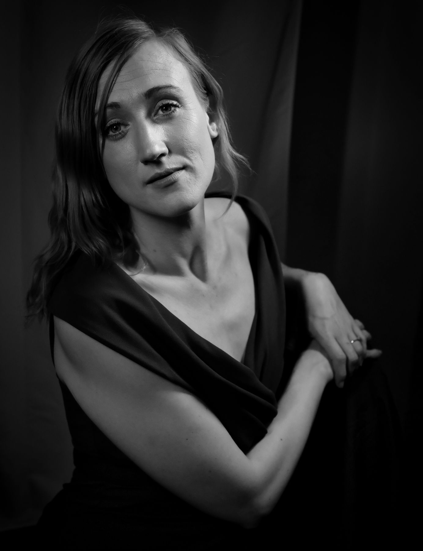 A posed monochrome photo of a female model