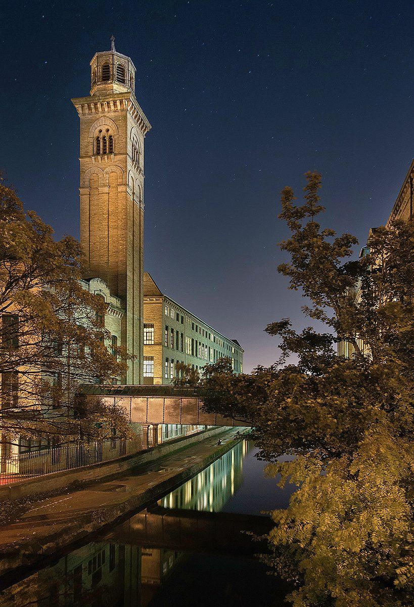 a night scene of salts mill, saltaire