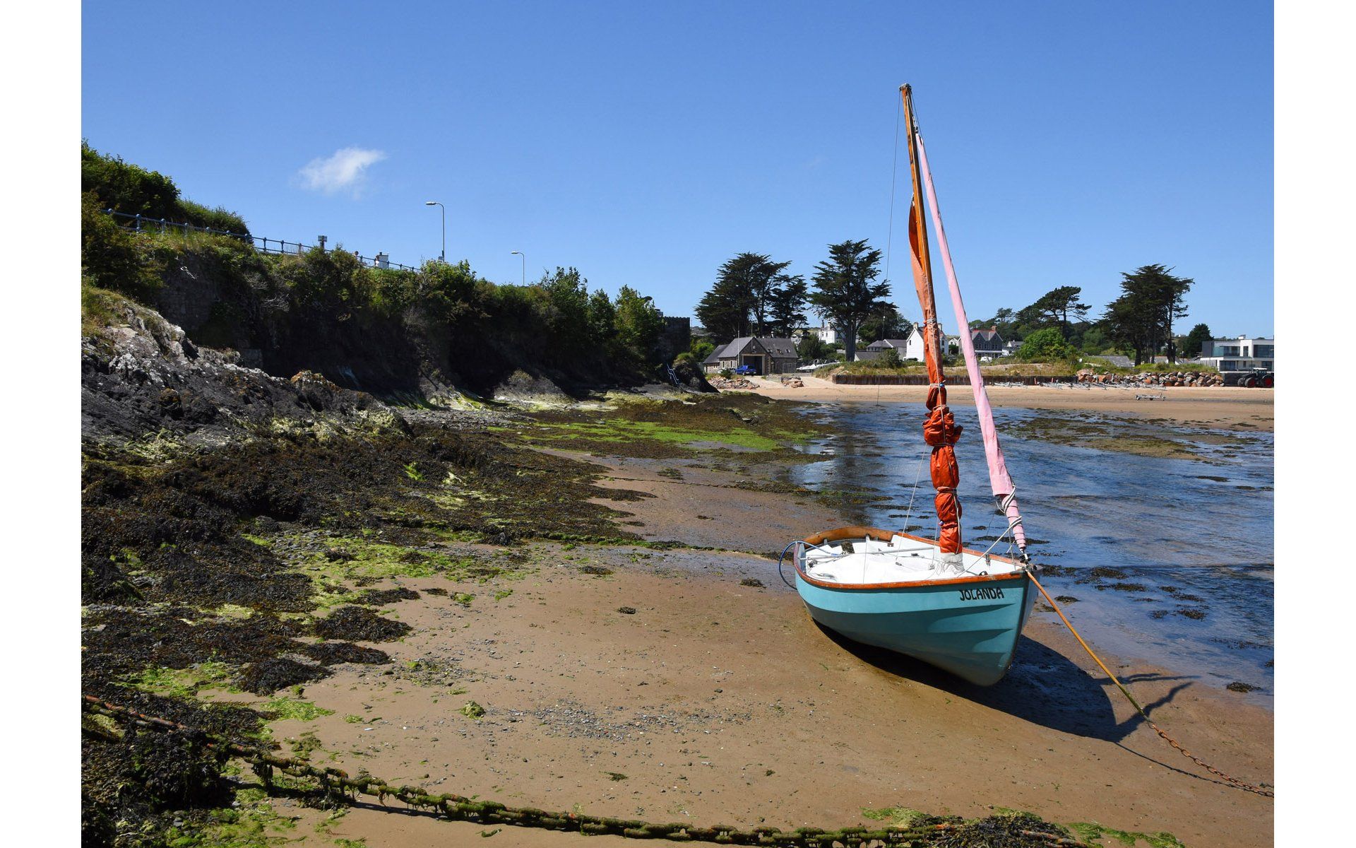 a sailing boat in a bay