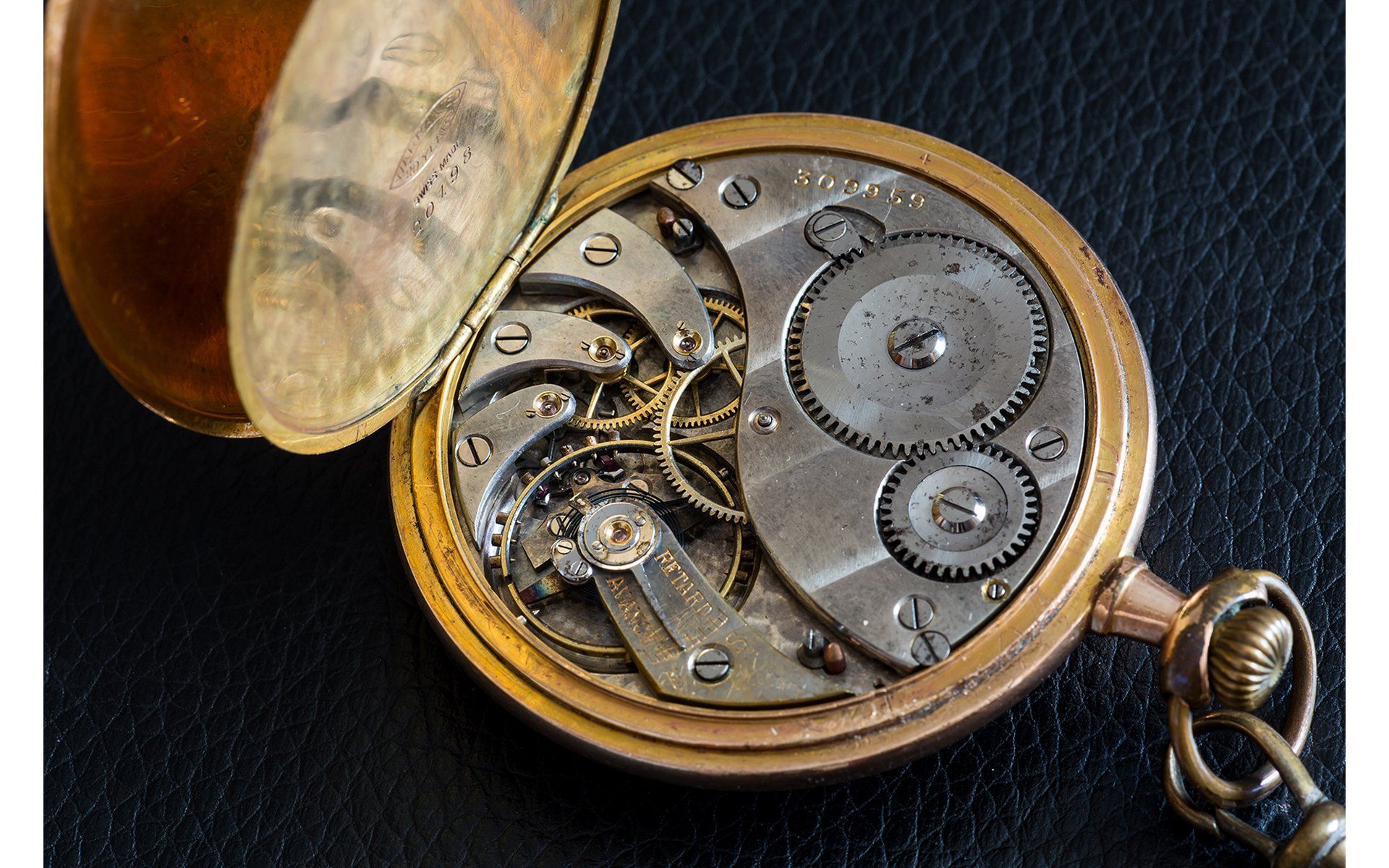 a pocket watch photo showing all the internal works