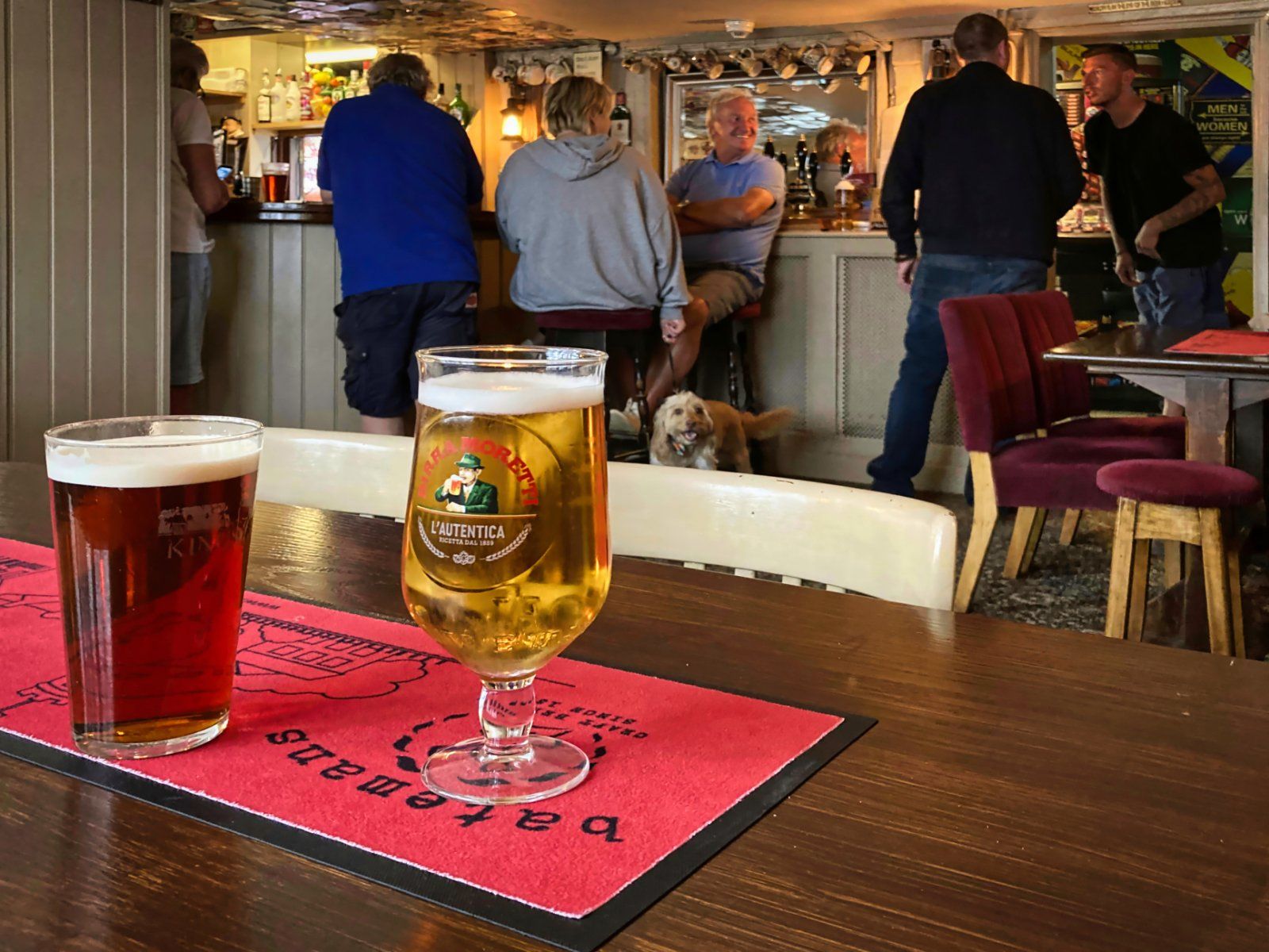 an interior view of a pub, and customers