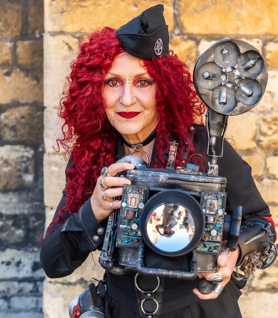 a steampunk woman with a dummy camera