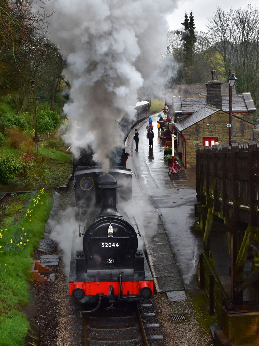 a heritage train arriving at Haworth headed by a steam locomotive