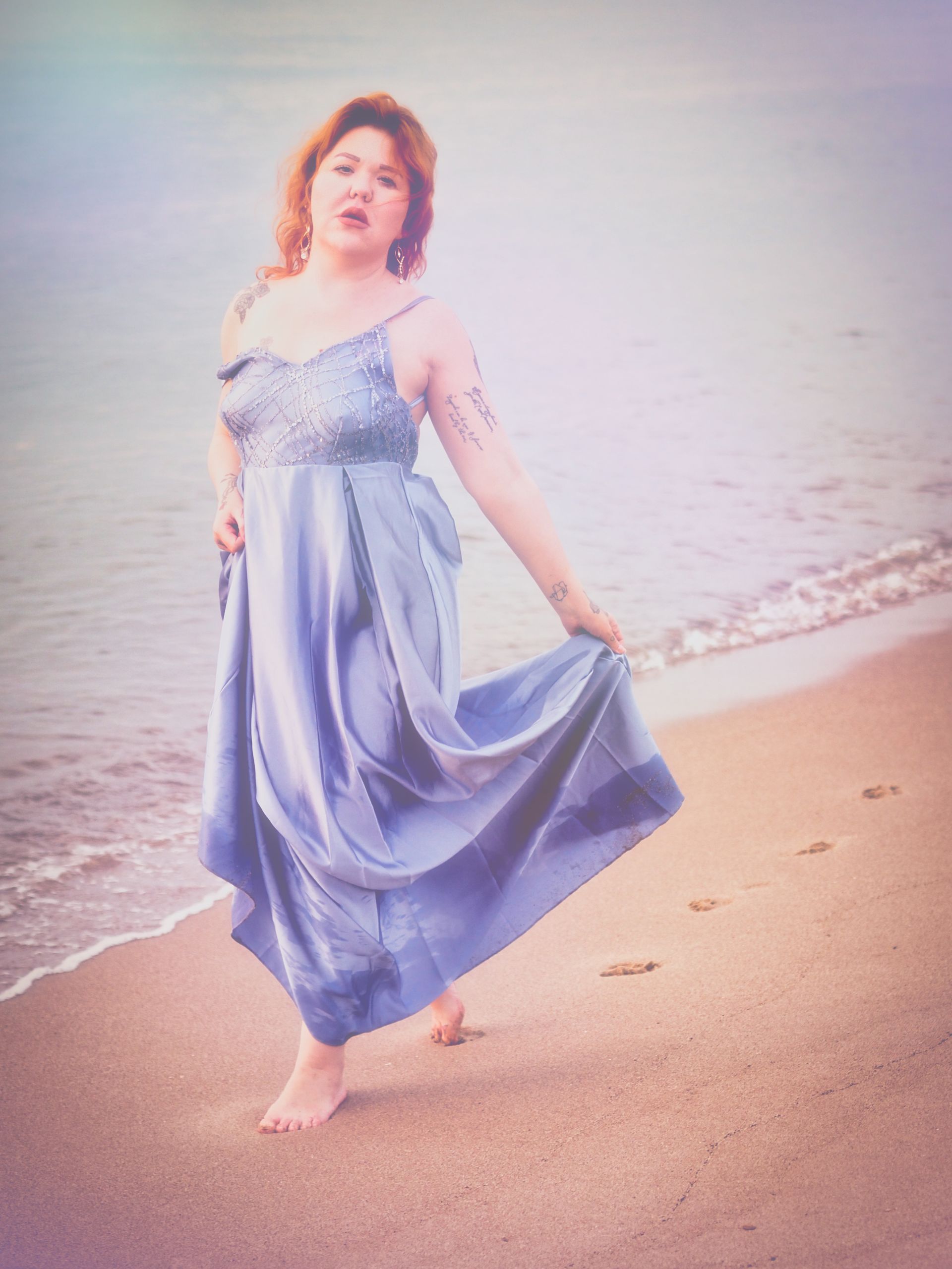 Beach Maiden by Derek Smith A young lady walking on the sand by the sea