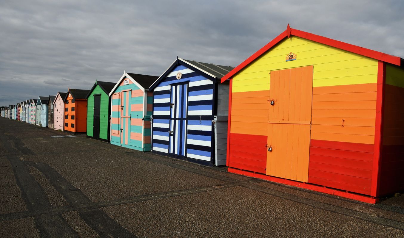 Beach Huts at Pakefield by Graham Harrison a row of beach huts at Pakefield