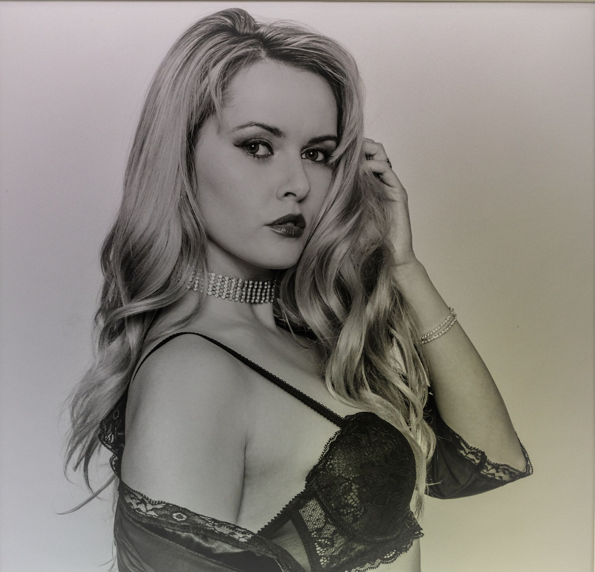 a portrait of a female in black lace lingerie