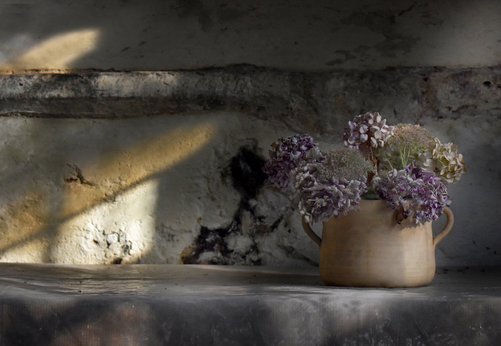 flowers in a church lit by window light
