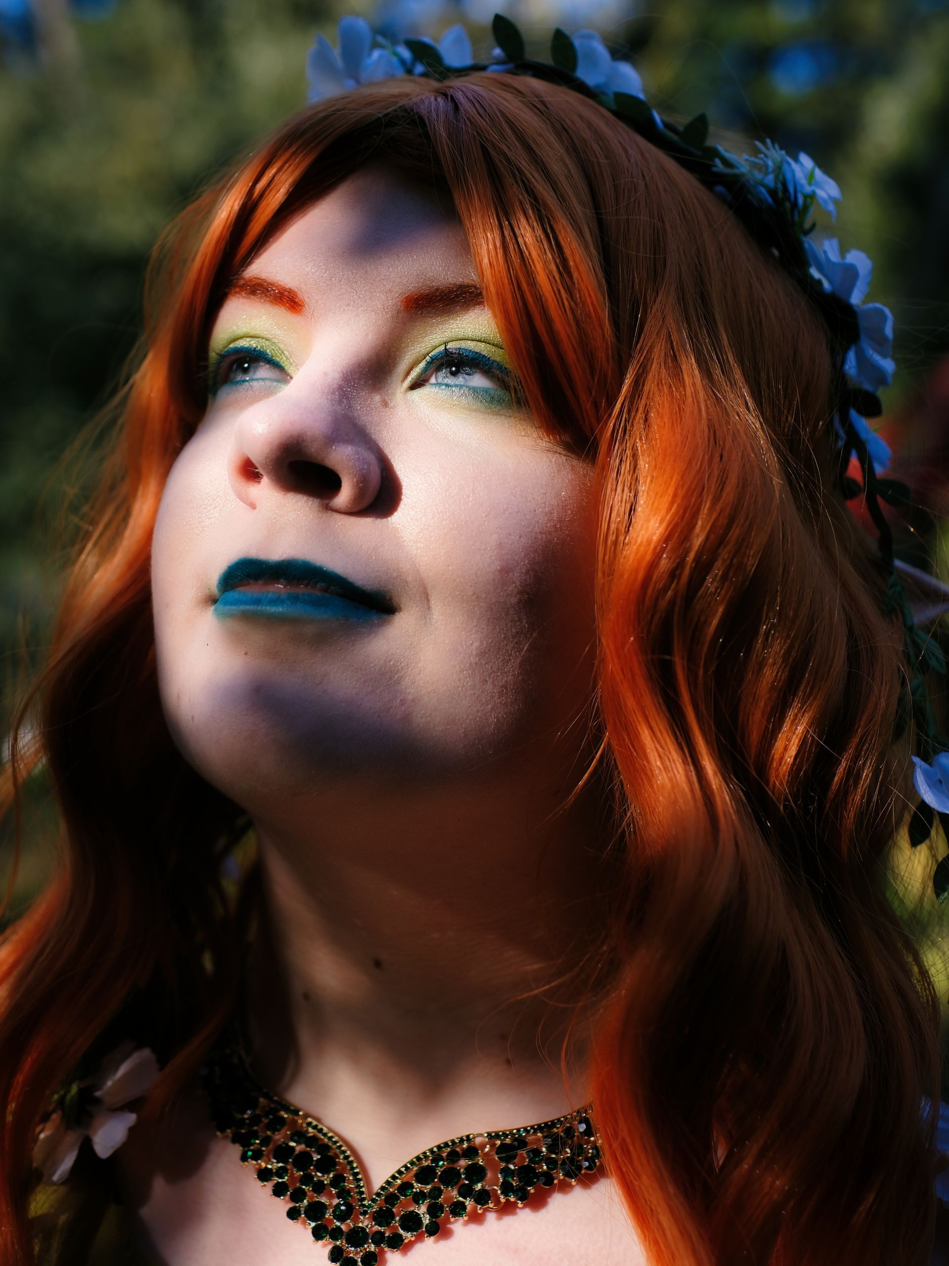 A female model in a cosplay costume, looking dramatic in the light