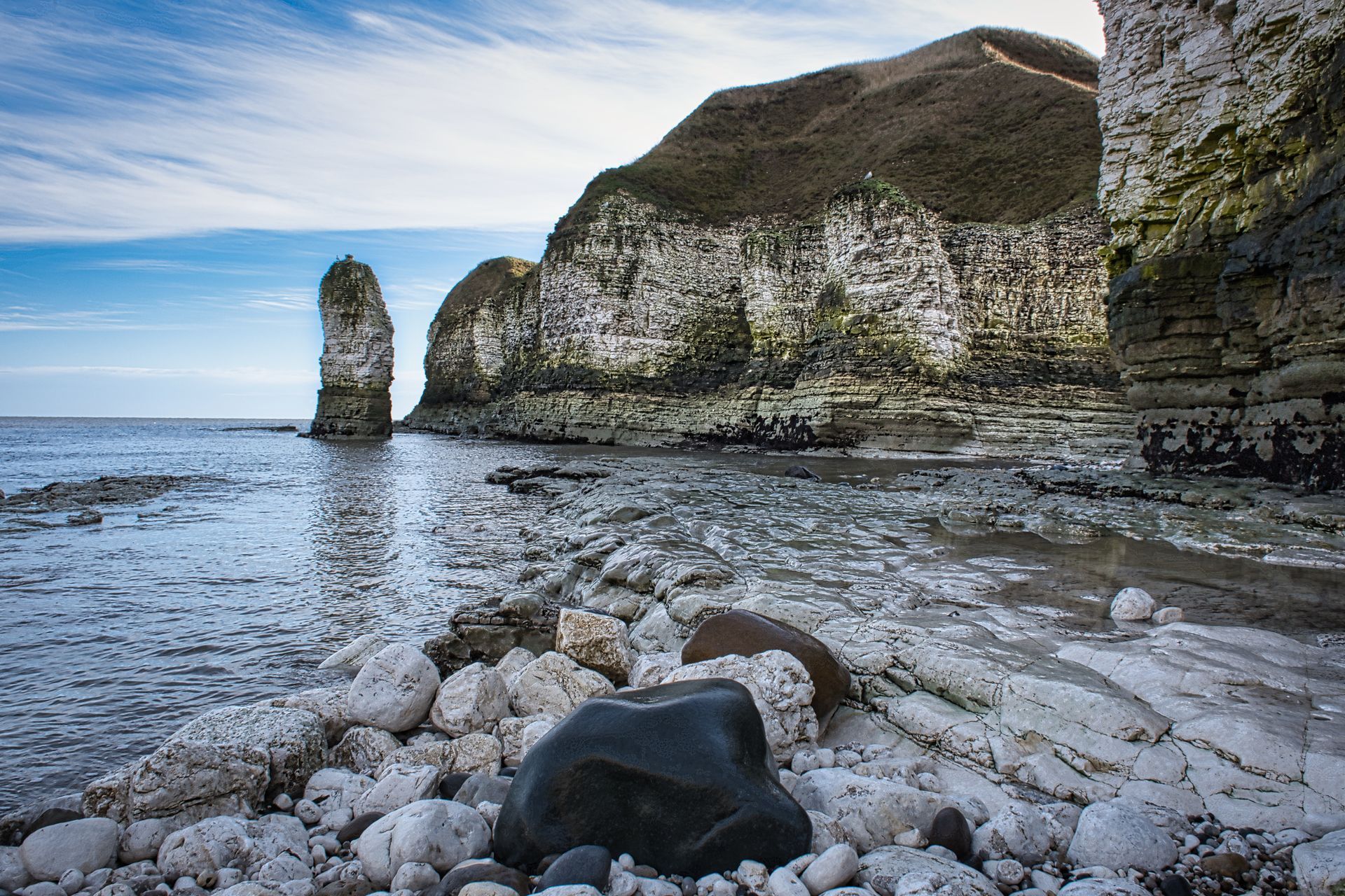 a view of a rocky bay at low tide