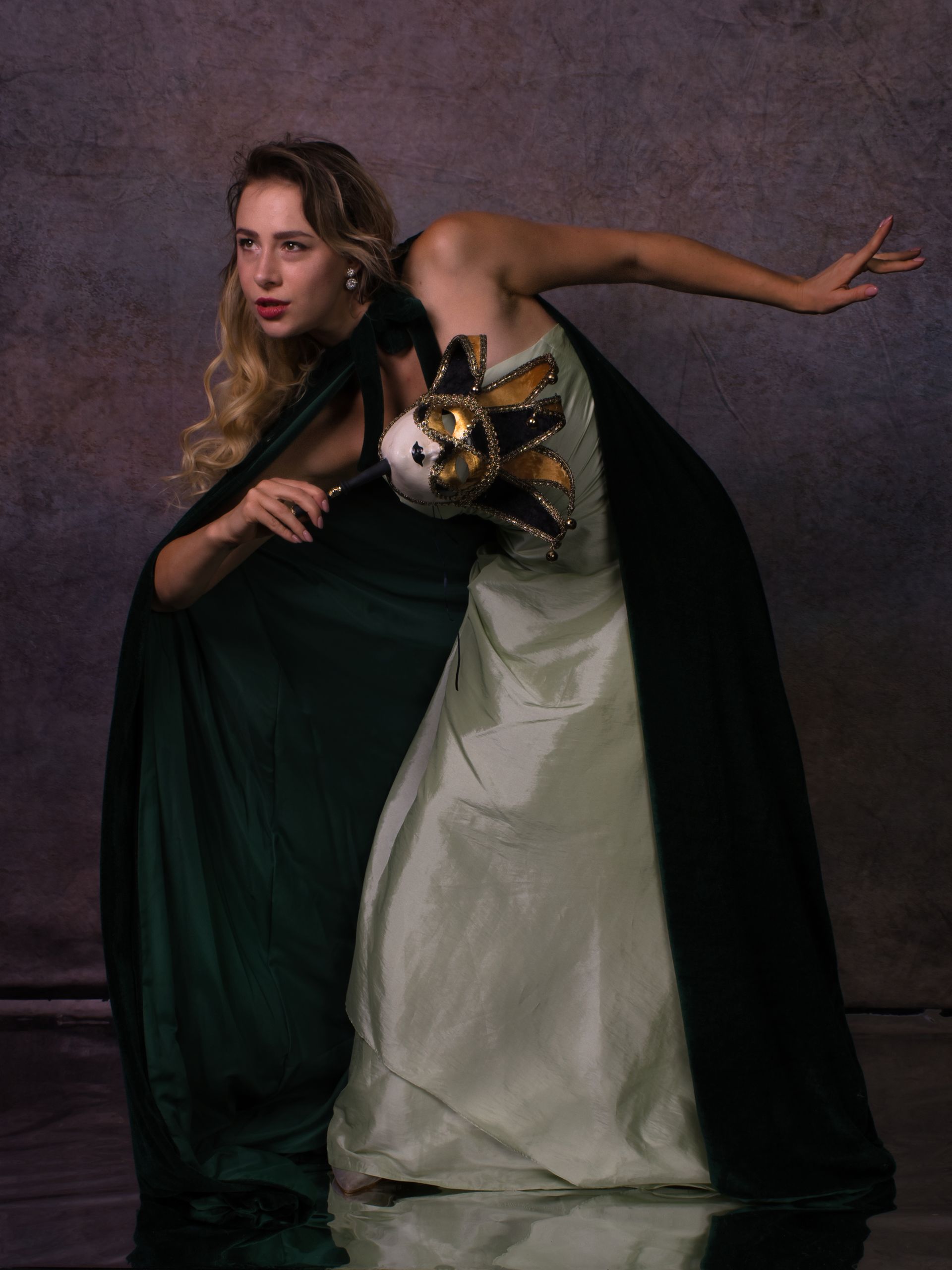 a female dancer at a masquerade ball