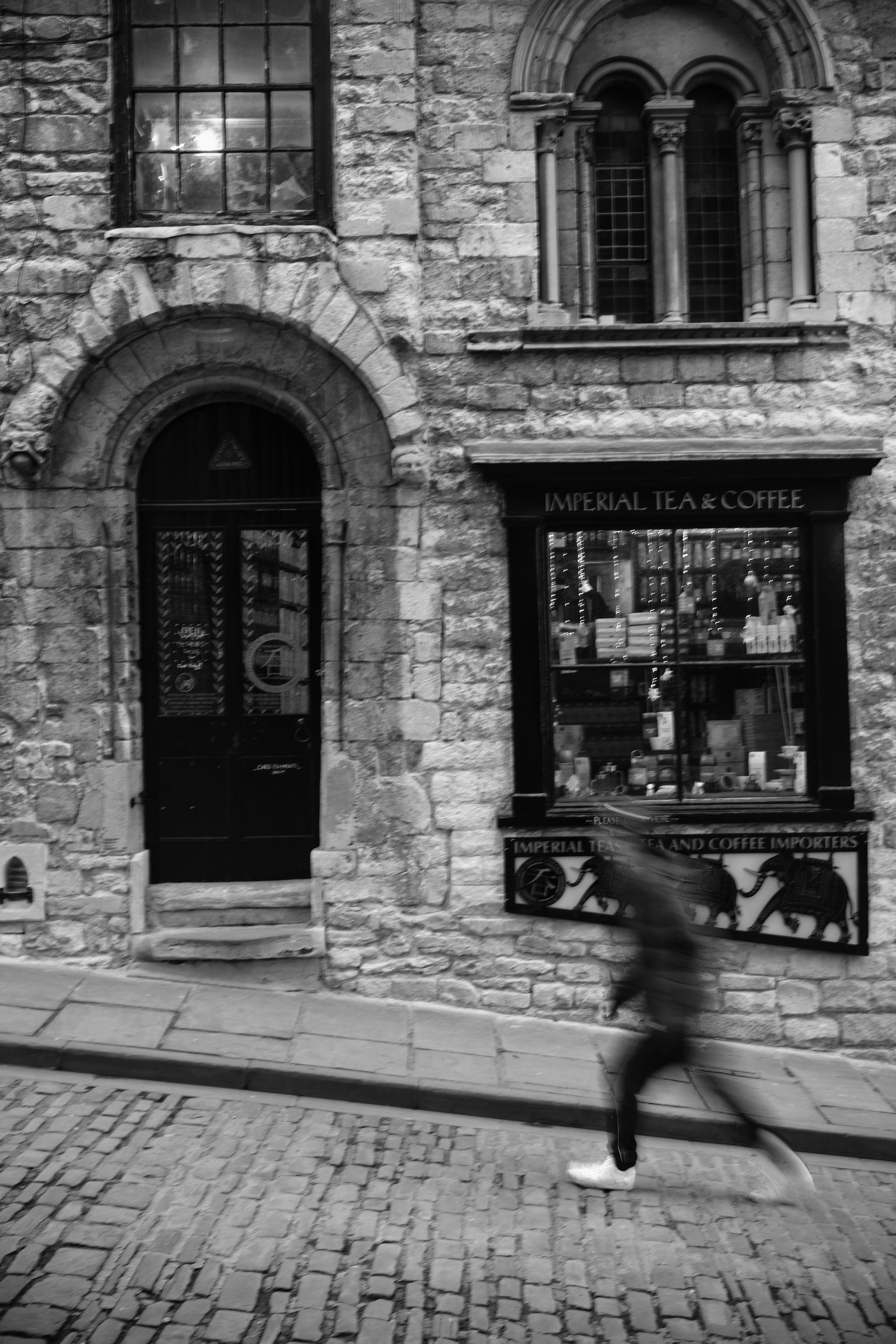 a man walking up Steep Hill Lincoln