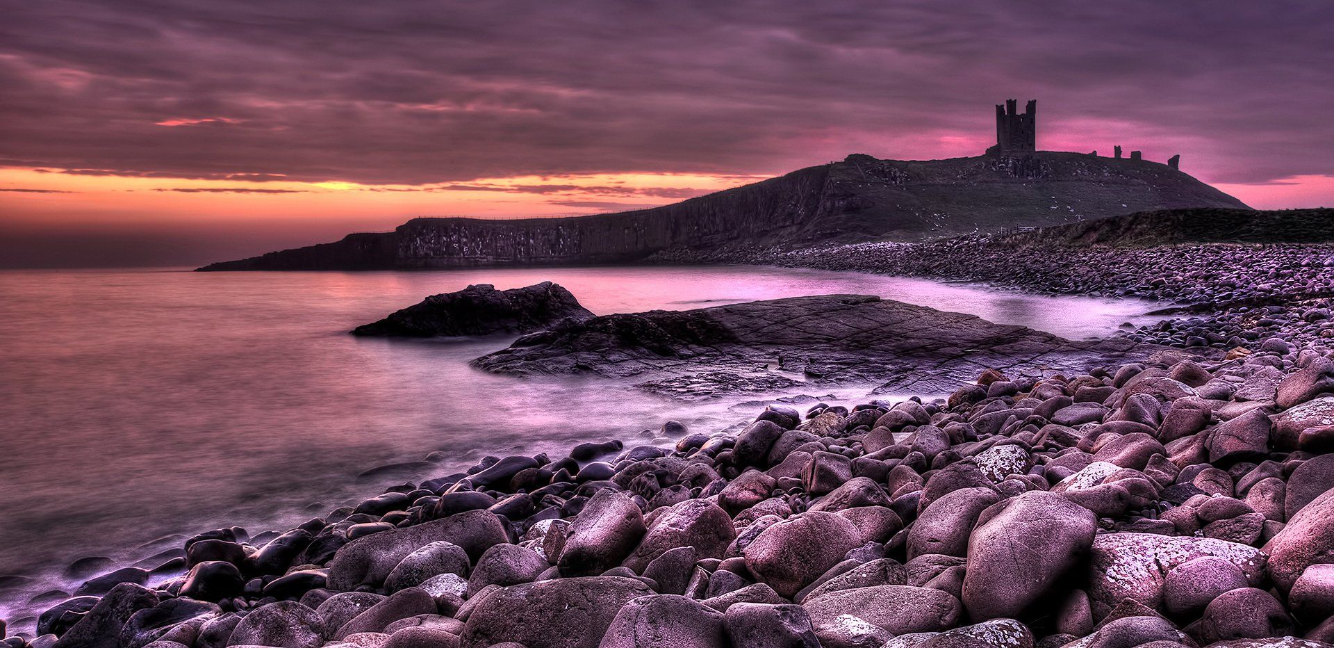 a view of dunstanburgh castle