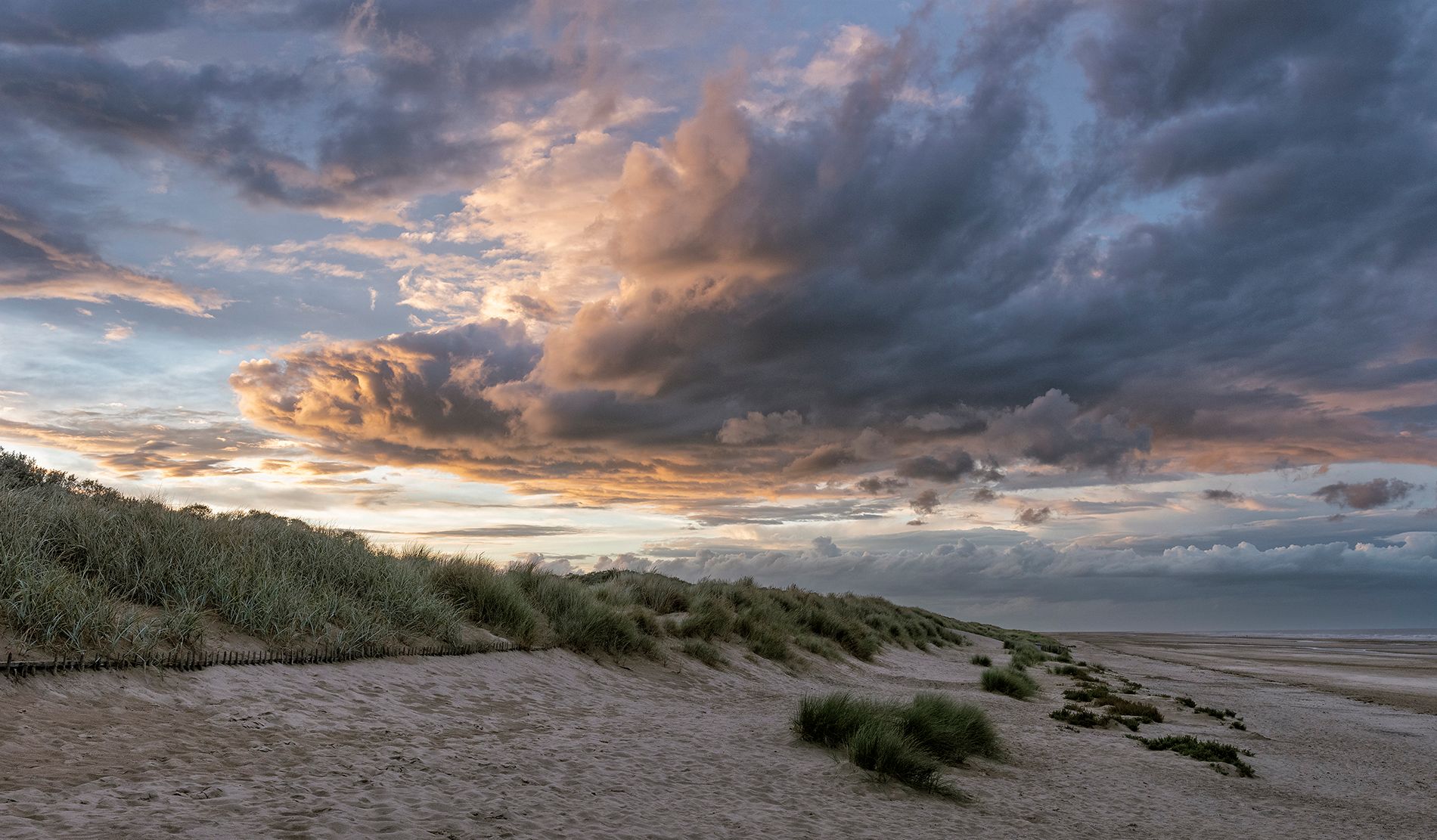 a storm rolling in over the beach
