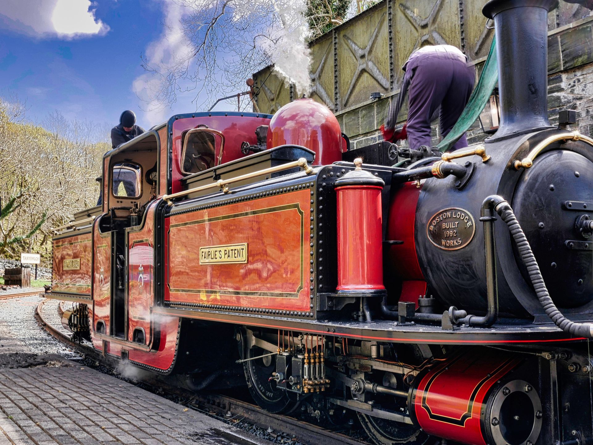 A Fairlie locomotive being watered on the Ffestiniog railway