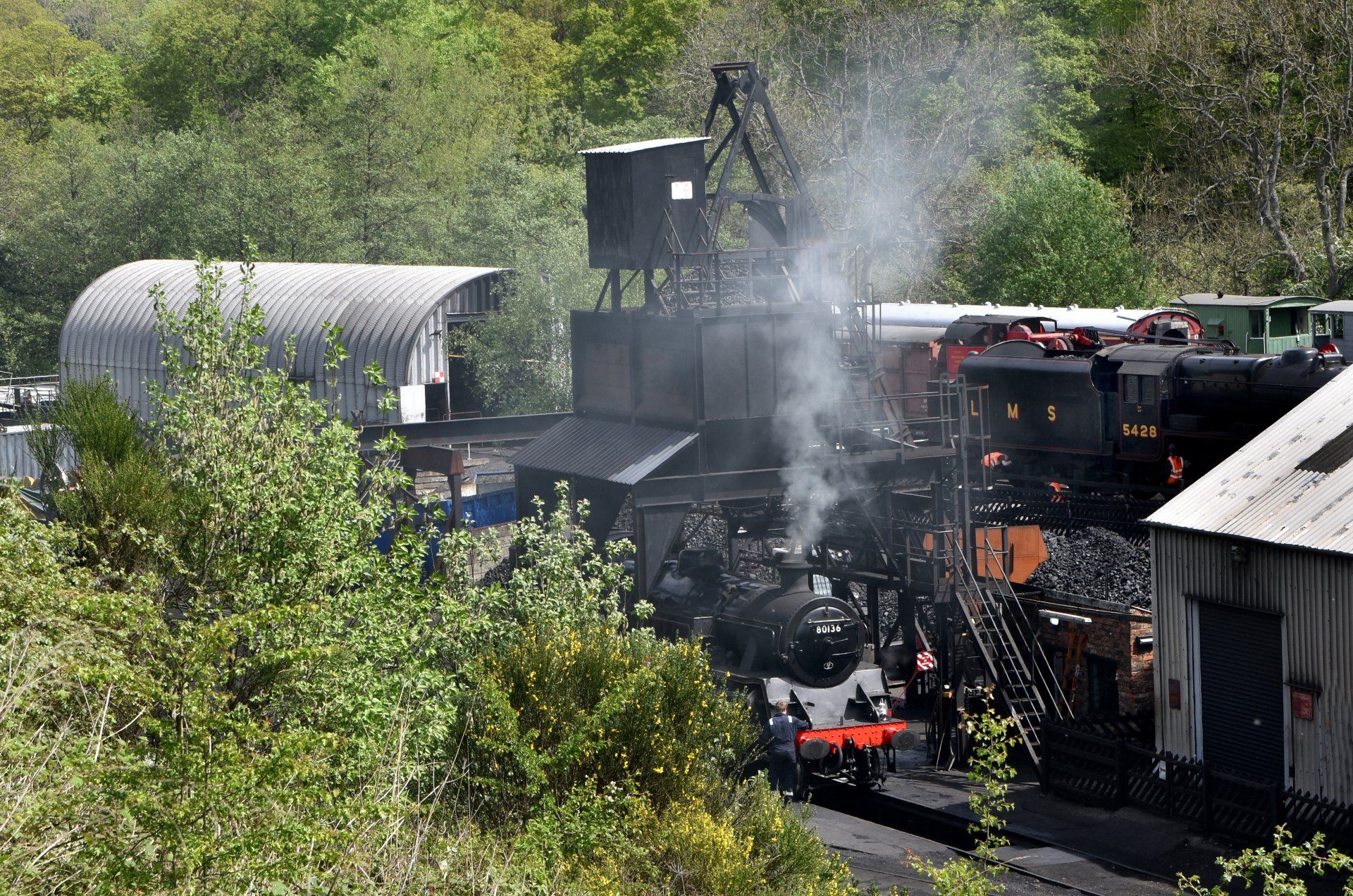 Photo by: Graham Harrison a steam locomotive filling up with water, and coal