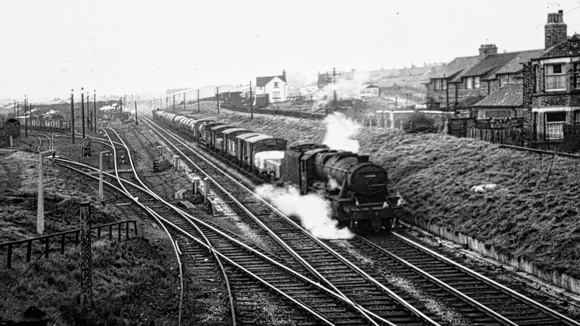 A steam hauled mixed goods train