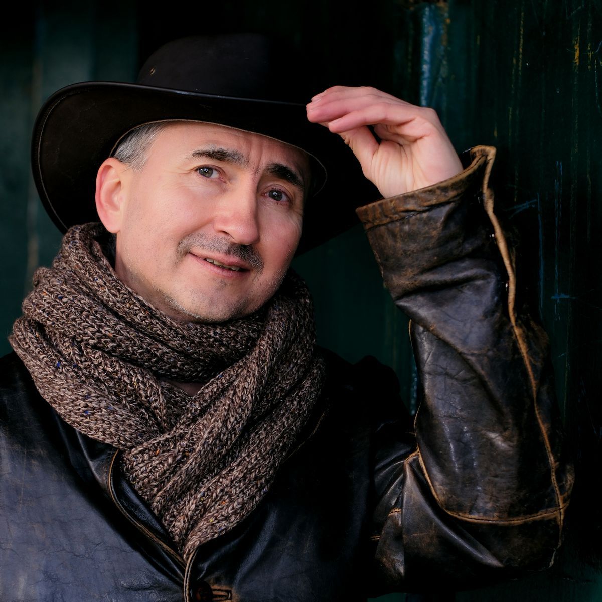 A portrait of a man wearing an Australia bush hat