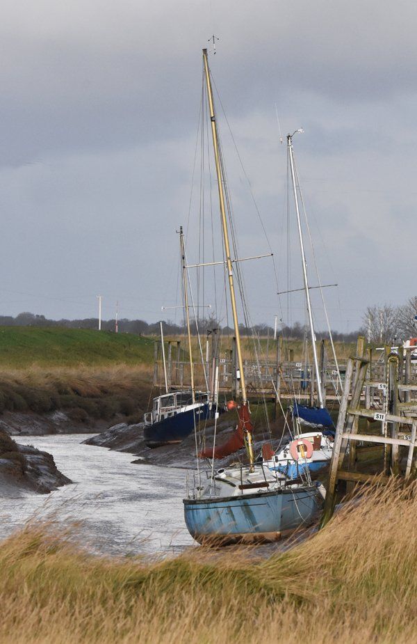 Photo by Graham Harrison sailing boats on the banks of a creek