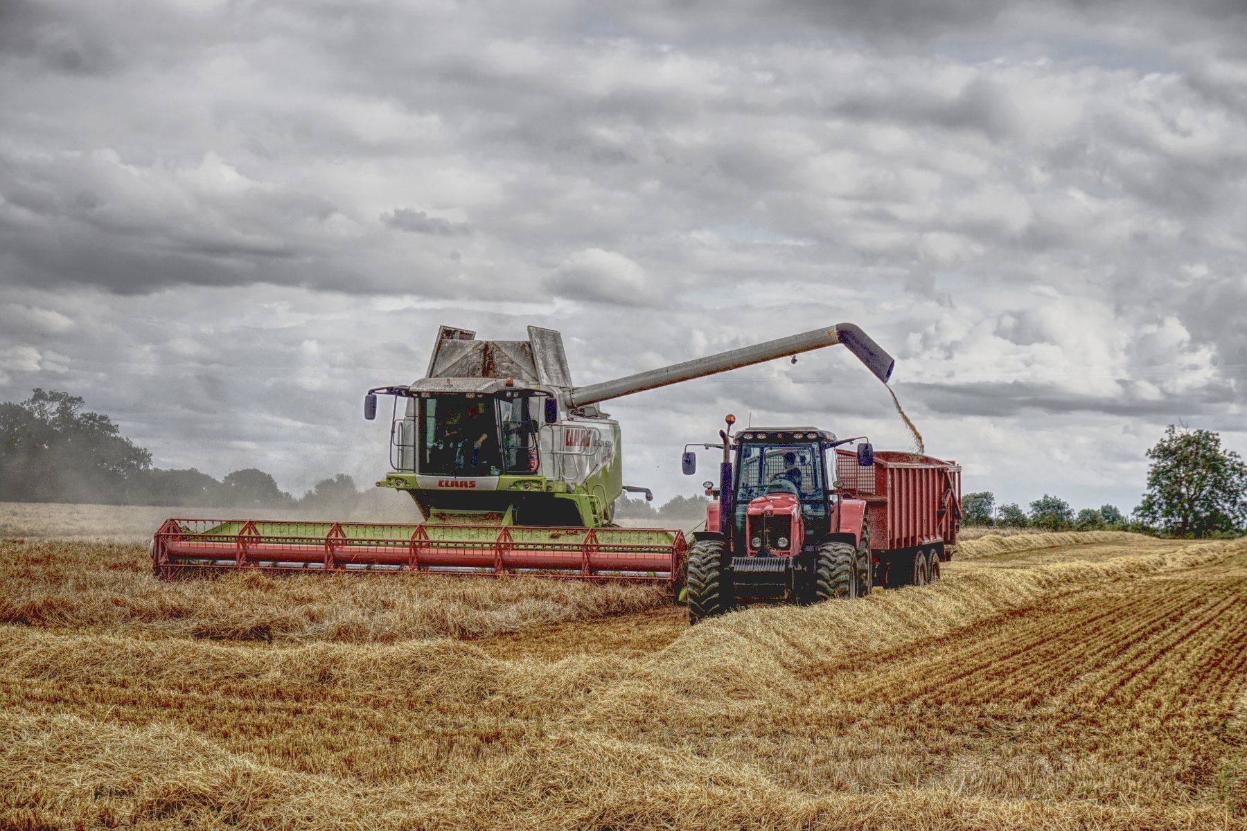 a combine harvester and tractor