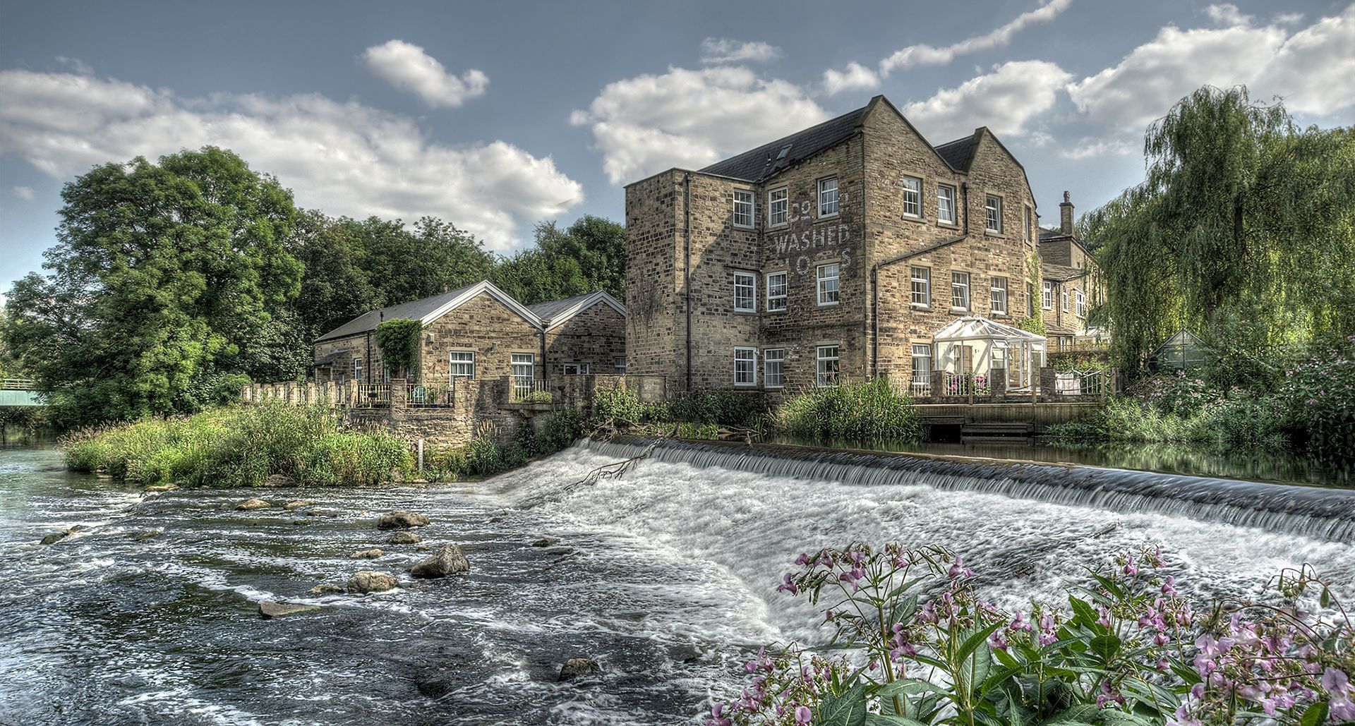 a view of Hirst Mill, on the River Aire