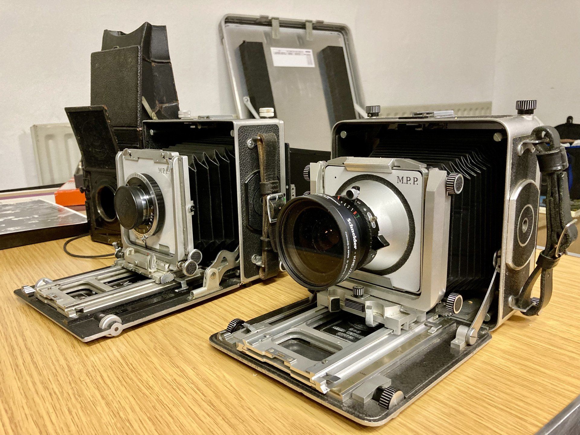 a pair of antique film cameras