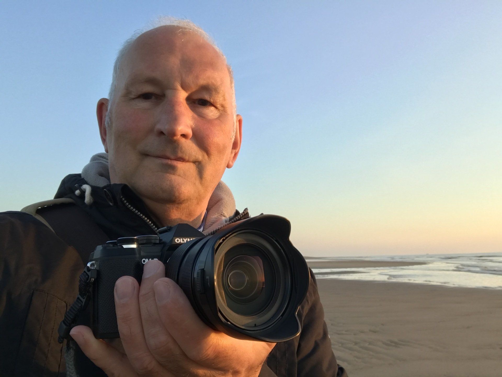 man on the beach with a camera
