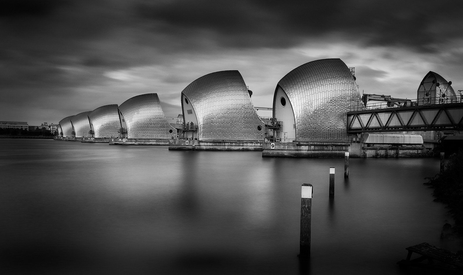 a monochrome view of the thames barrier