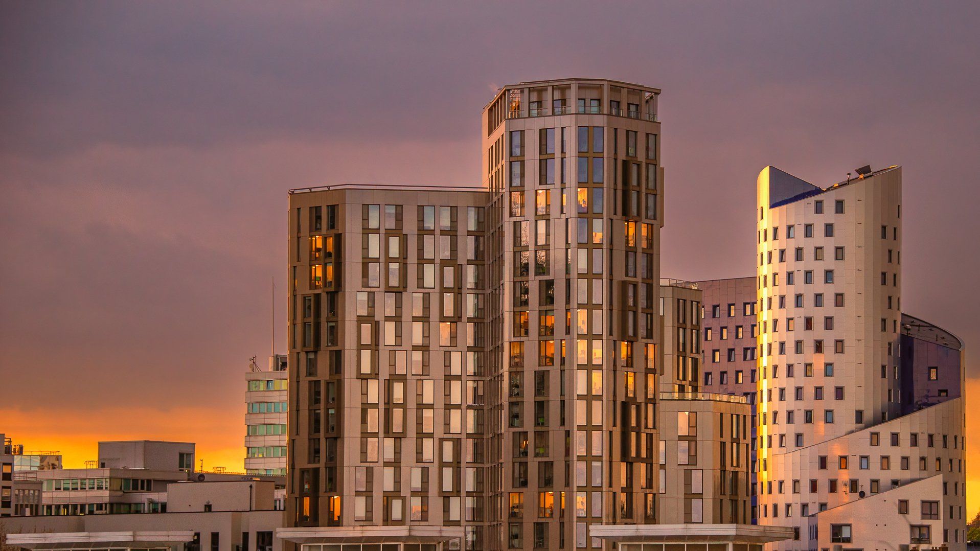 a view of an office building at sunset