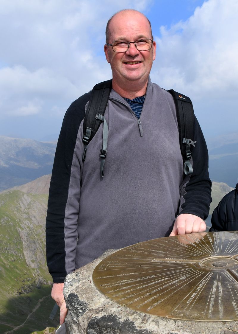 Graham Harrison pictured on the top of mount Snowdon