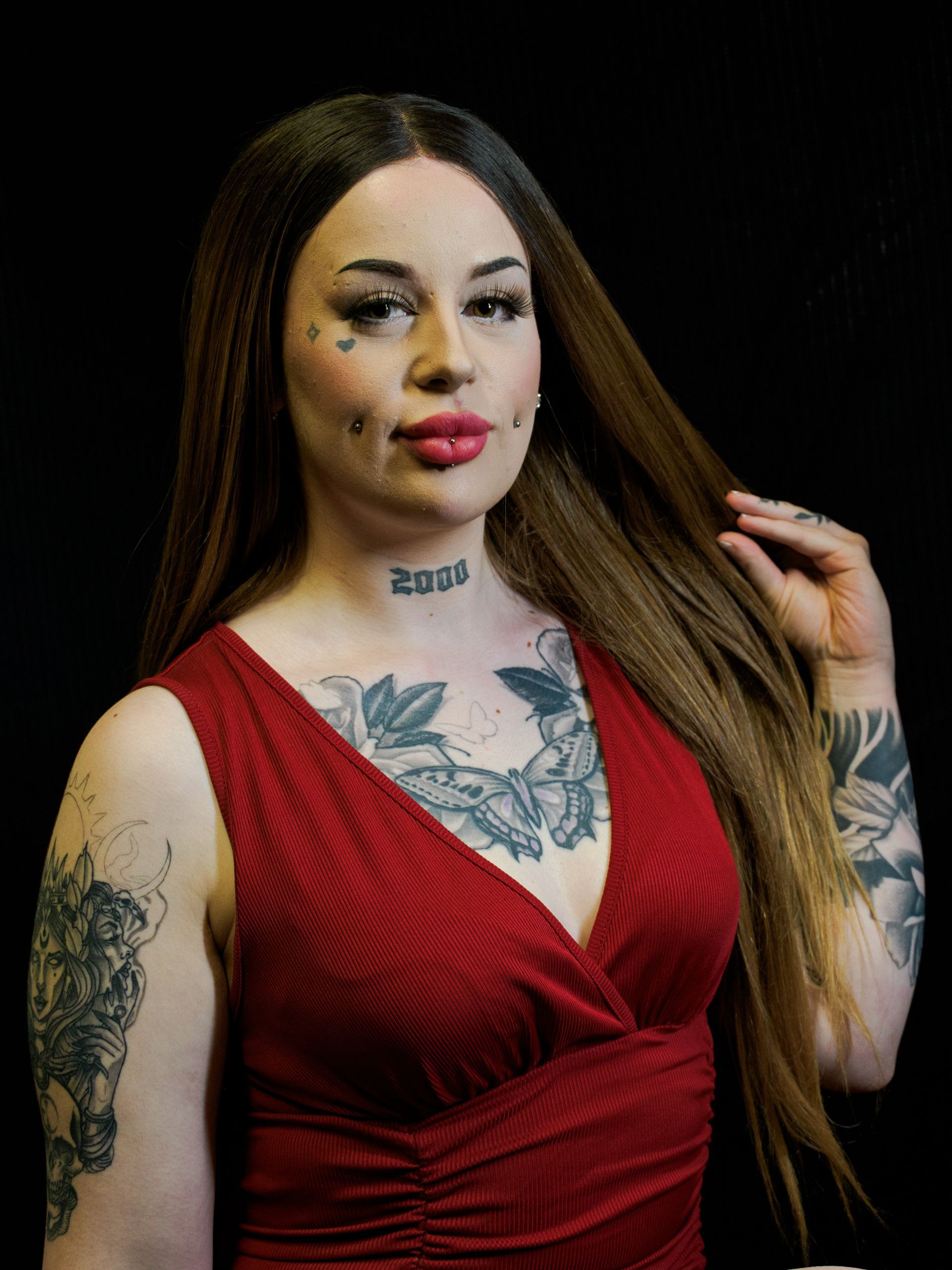 a female model posed in a red dress.