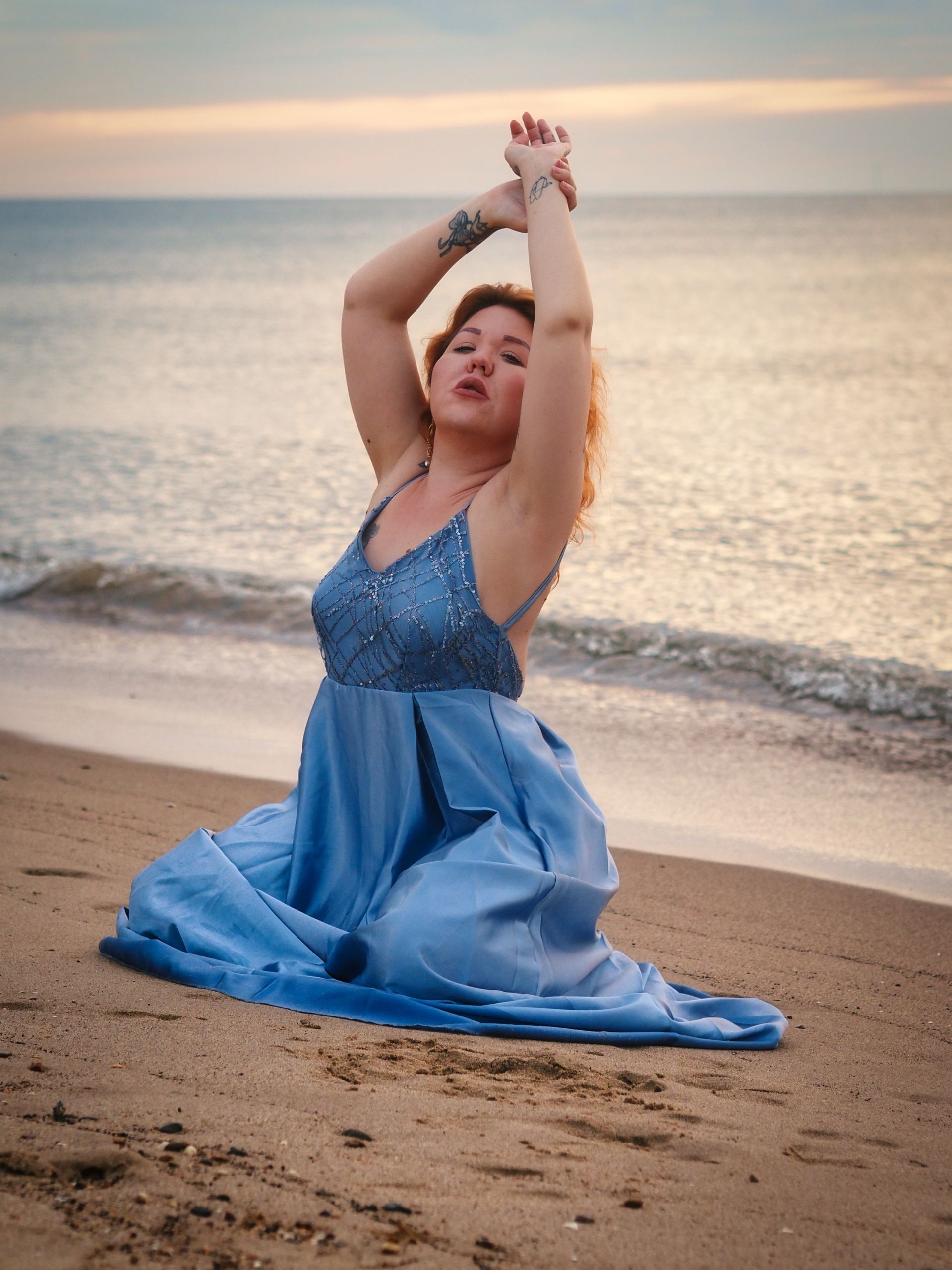 Rachel at 05:23, on Skegness Beach by Derek Smith a female model posing on a beach at sunrise