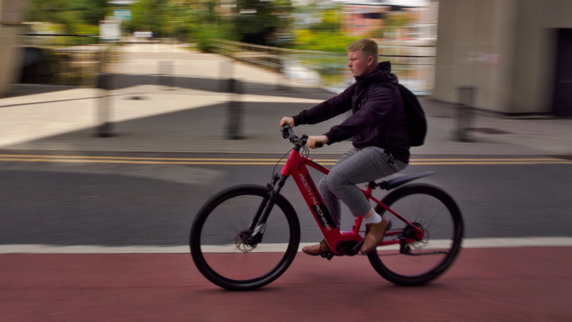 A long exposure panning shot of a cyclist