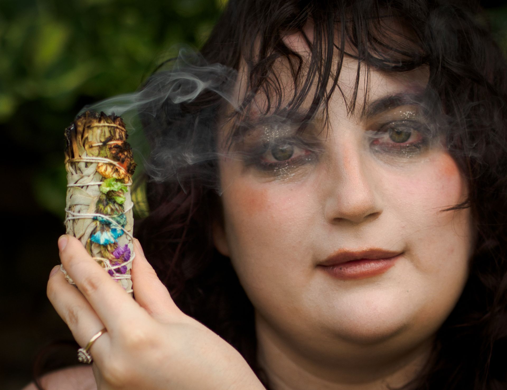 A smoking portrait, of a female model taken with a prime portrait lens