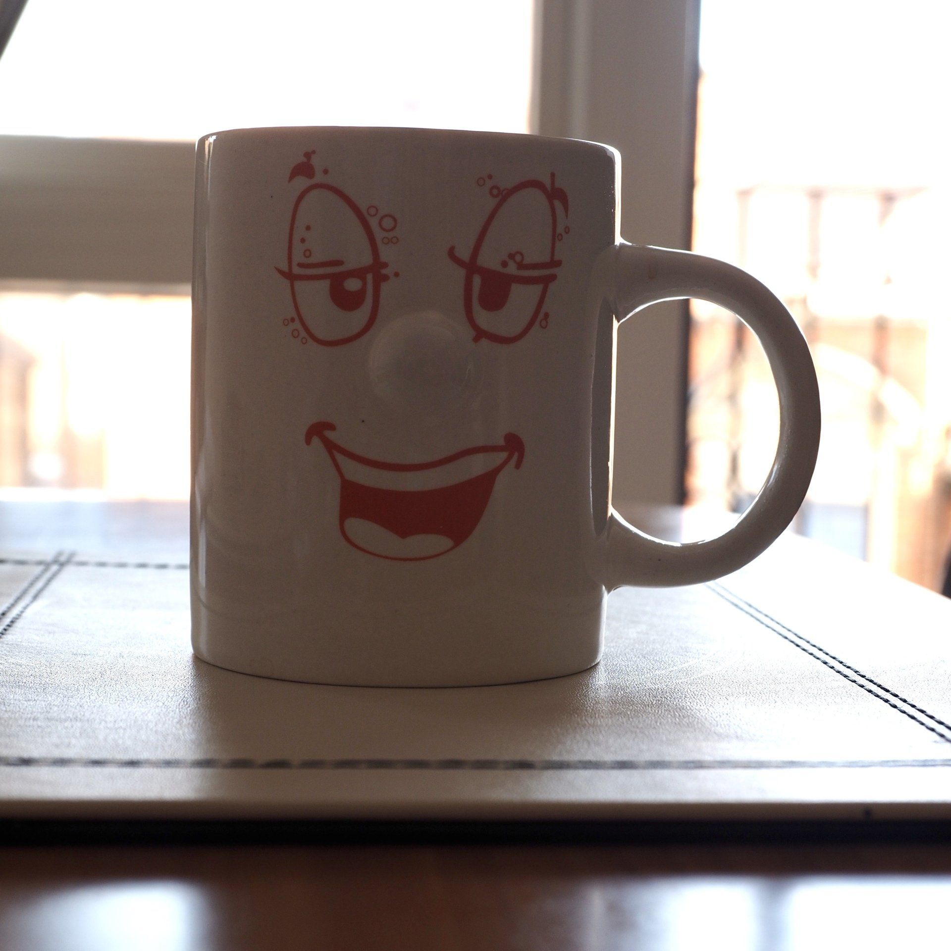 a photo of a coffee mug with different exposures.